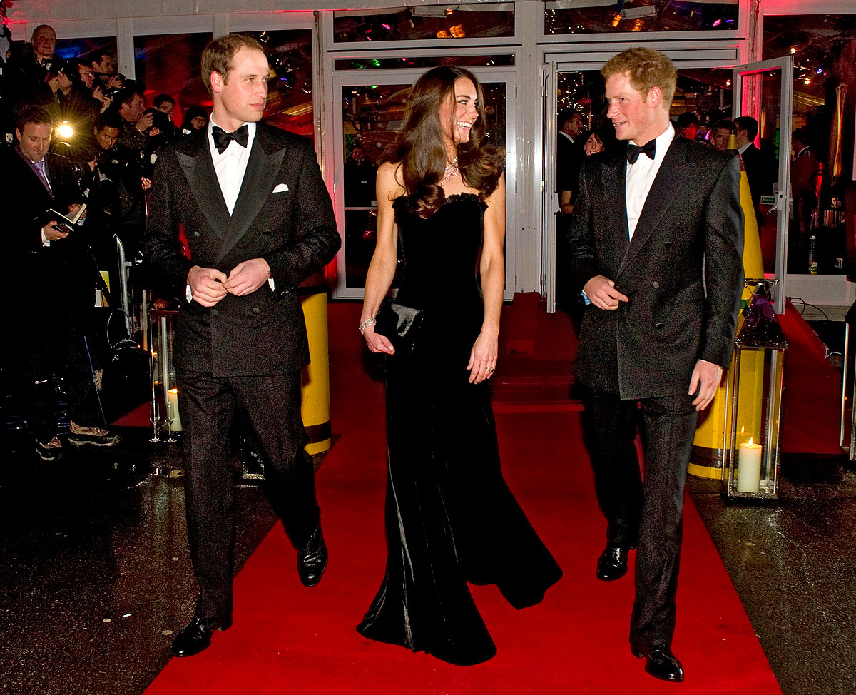 Britain's Prince William (L) and his wife Catherine, Duchess of Cambridge and Prince Harry (R) leave the VIP marquee during a military awards ceremony, A Night of Heroes, at the Imperial War Museum in central London December 19, 2011. REUTERS/Arthur 