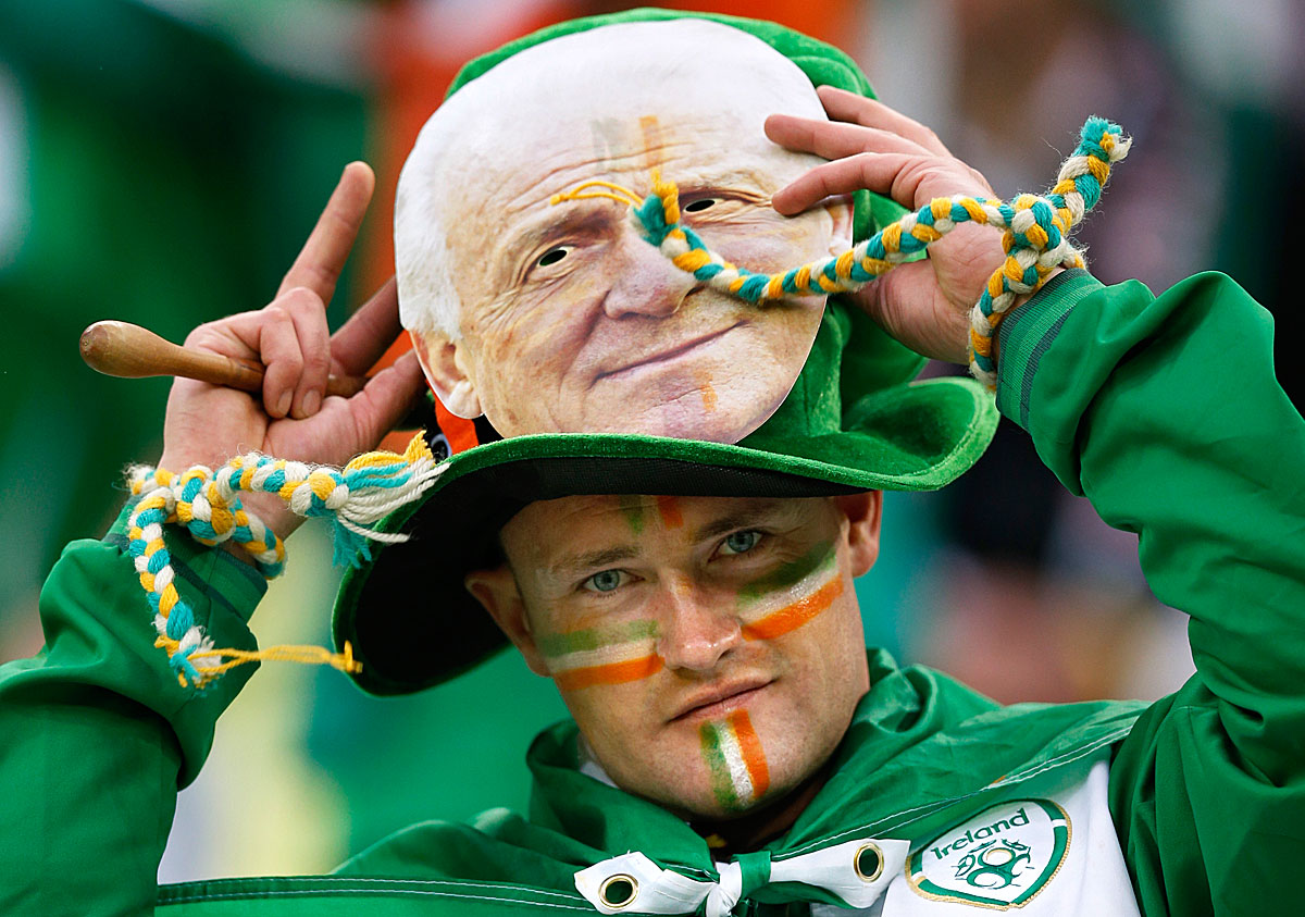 An Ireland's fan with a mask of Ireland's coach Giovanni Trapattoni waits for the start of their Group C Euro 2012 soccer match against Spain at the PGE Arena stadium in Gdansk, June 14, 2012.    REUTERS/Thomas Bohlen (POLAND  - Tags: SPORT SOCCER)