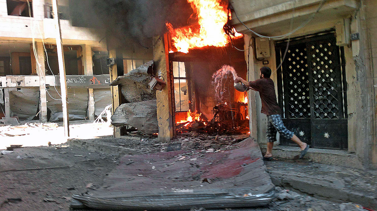 A fire burns after a shelling at Juret al-Shayah in Homs city July 1, 2012.  REUTERS/Shaam News Network/Handout (SYRIA - Tags: POLITICS CIVIL UNREST) FOR EDITORIAL USE ONLY. NOT FOR SALE FOR MARKETING OR ADVERTISING CAMPAIGNS. THIS IMAGE HAS BEEN SUP