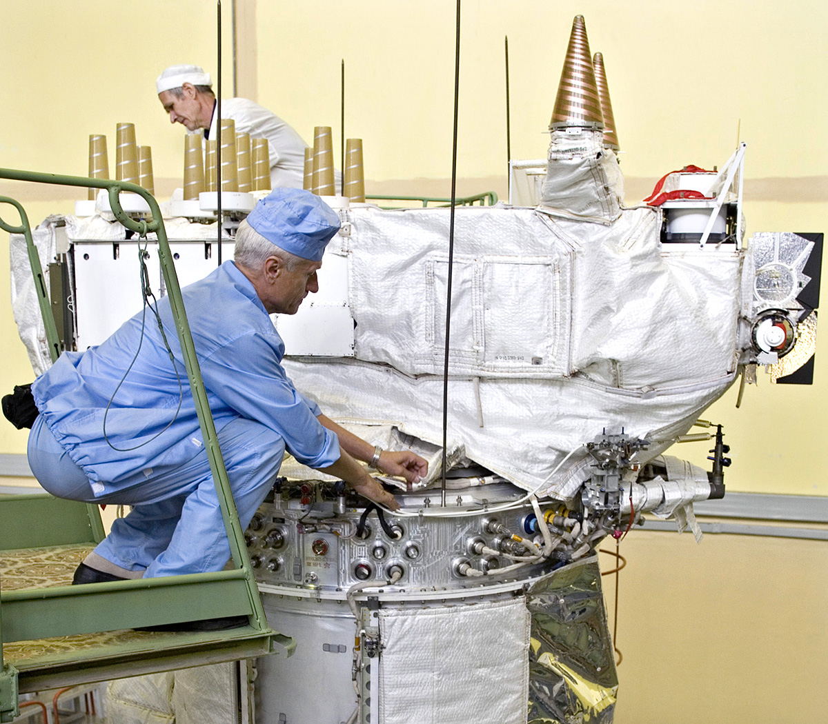 Engineers work on a Global Navigation Satellite System (GLONASS) satellite at the NPO PM applied mechanics institute in the Siberian city of Zheleznogorsk near Krasnoyarsk July 10, 2007. Russia's government-funded GLONASS is a satellite navigation sy