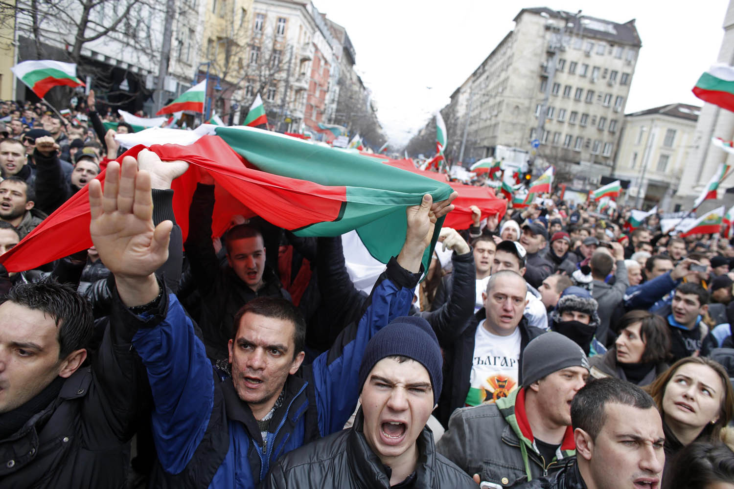 Thousands of demonstrators march shouting slogans during a protest against high utility bills and monopolies in the energy sector in Sofia February 24, 2013. Tens of thousands of Bulgarians marched through cities across the Balkan country on Sunday, 