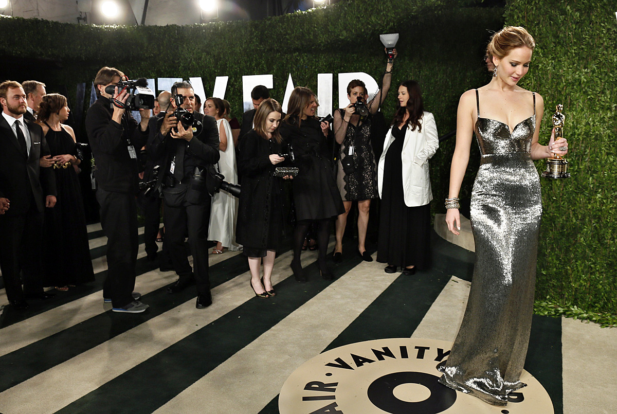 Jennifer Lawrence holds her award for Best Actress for her role in 