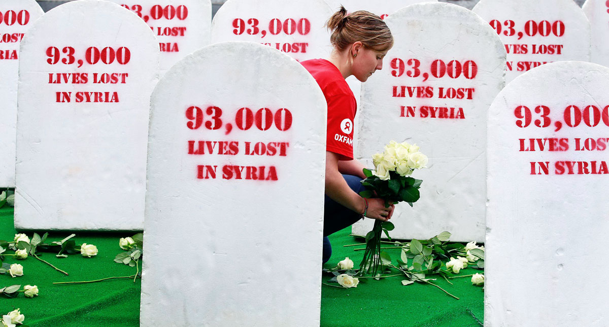 93 ezer élet veszett el Szíriában – ezekkel a táblákkal fogadták a G8-ak vezetőit