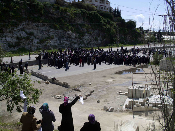 Women demonstrate on the Baida coastal highway April 13, 2011. Hundreds of women from a Syrian town that has witnessed mass arrests of its men marched along Syria's main coastal highway on Wednesday to demand their release, human rights activists sai