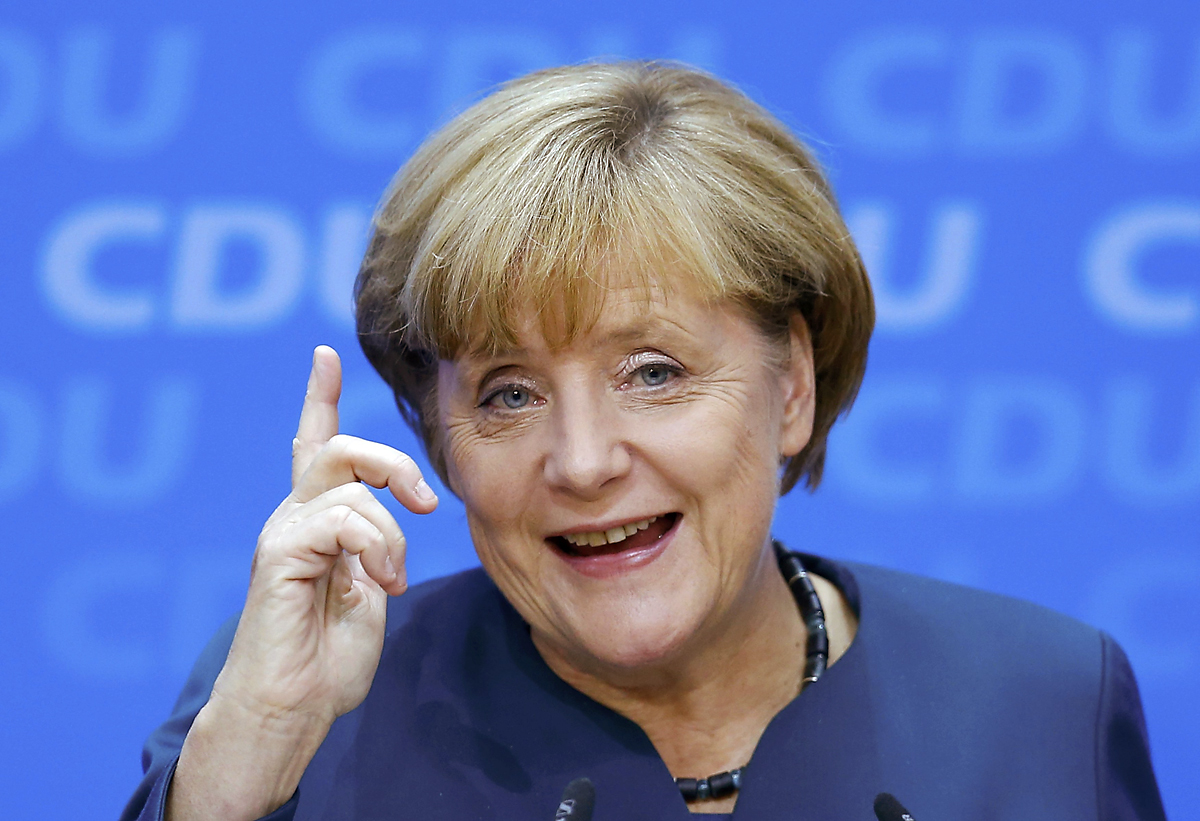 German Chancellor and leader of the Christian Democratic Union ( CDU) Angela Merkel, gestures during a news conference after a CDU party board meeting in Berlin September 23, 2013, the day after the general election. Merkel faces the daunting prospec