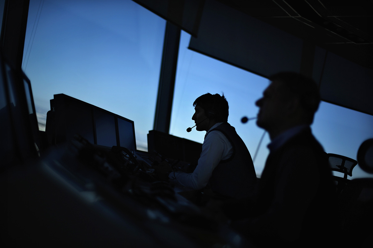 Air traffic controllers work at the newly opened control tower at Sofia Airport December 4, 2012. The new tower, which took a year to build and will have its official opening on Wednesday morning, is part of a project featuring an expansion of the So