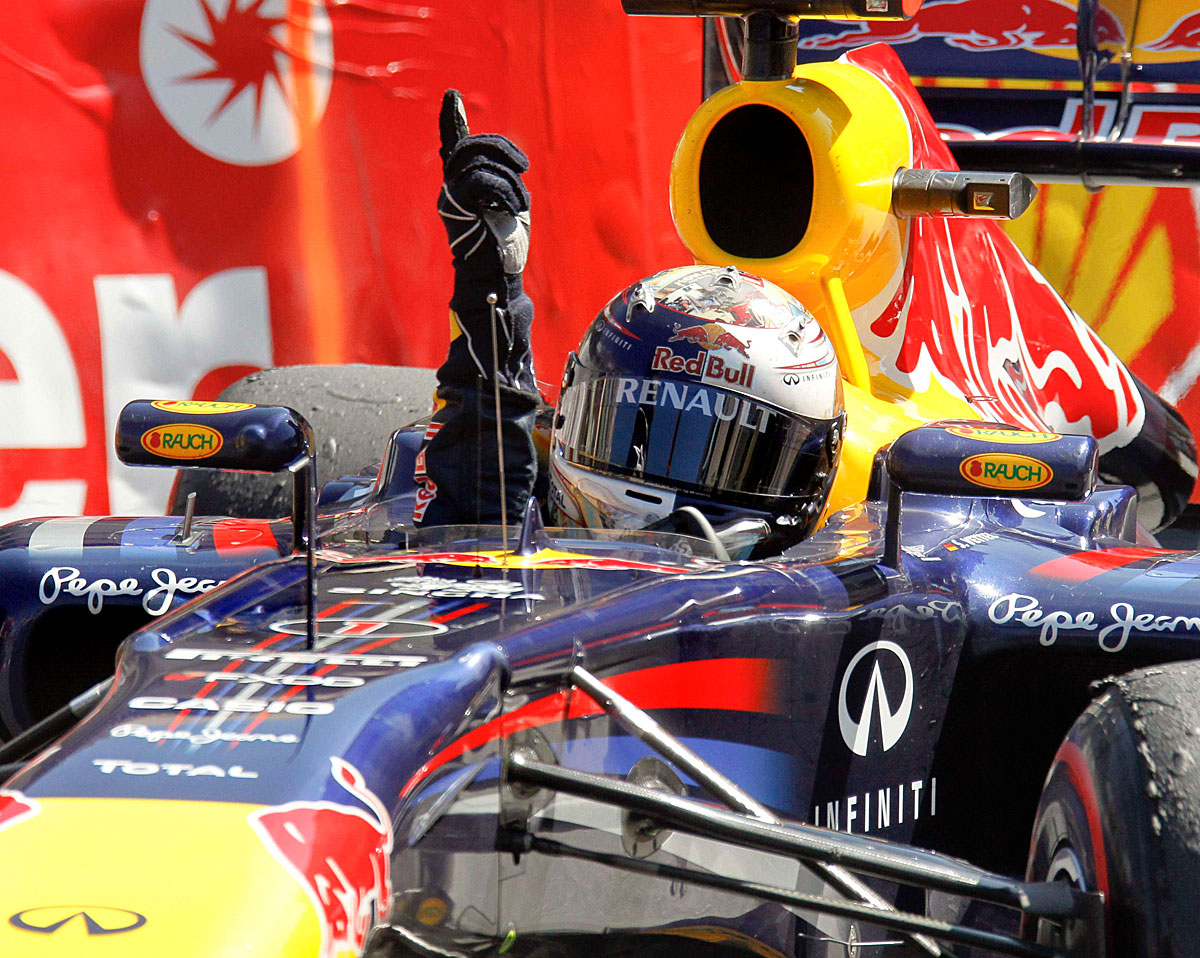 Red Bull Formula One driver Sebastian Vettel of Germany gestures after winning  the Monaco F1 Grand Prix May 29, 2011. REUTERS/Robert Pratta (MONACO - Tags: SPORT MOTOR RACING)