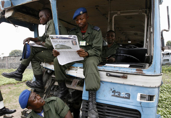 Congolese soldiers wait for their turn to register during a new census of the army at an air base in the capital Kinshasa, September 27, 2007. Congo hopes a new biometric identity card scheme backed by the European Union can help overhaul its undisci