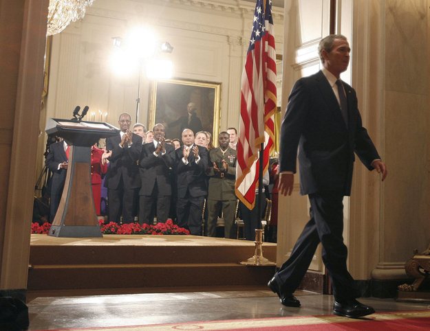 U.S. President George W. Bush walks from the podium in the White House East Room at the end of his prime time live television address to the nation in Washington January 15, 2009. Bush on Thursday defended his actions to avert a collapse of the finan