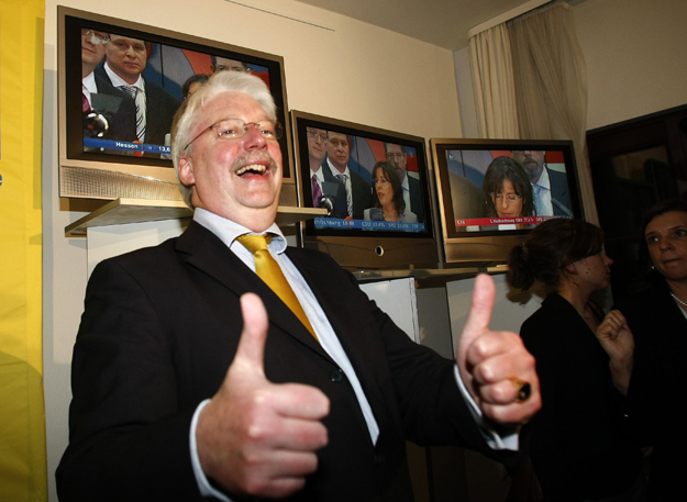 Joerg-Uwe Hahn of the Free Democratic Party (FDP) reacts on first exit polls for the state elections of Hesse at the federal state's parliament in Wiesbaden January 18, 2009. German Chancellor Angela Merkel's conservatives won enough support in a vot