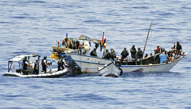 Dutch NATO soldiers intervene on a ship off Somalia's coast in this NATO handout photo made available April 18, 2009. Dutch commandos freed 20 Yemeni hostages on Saturday and briefly detained seven pirates who had forced the Yemenis to sail a 