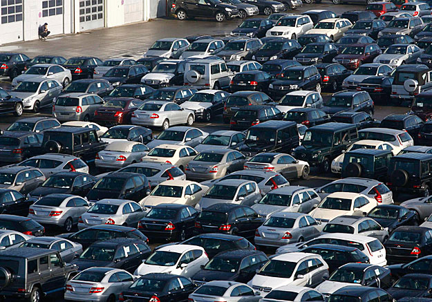 Cars are parked in the car park of Simon car re-import company in Emmering near Munich, December 8, 2008. German carmakers such as BMW and Daimler have announced cuts to production due to falling demand, and analysts expect unemployment to start risi