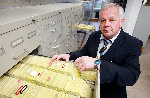 Senior Public Prosecutor Kurt Schrimm, head of the Central Office of the Judicial Authorities of the Federal States for the Investigation of National Socialist Crimes, poses in the central card index room in Ludwigsburg March 14, 2008. Germany's chie