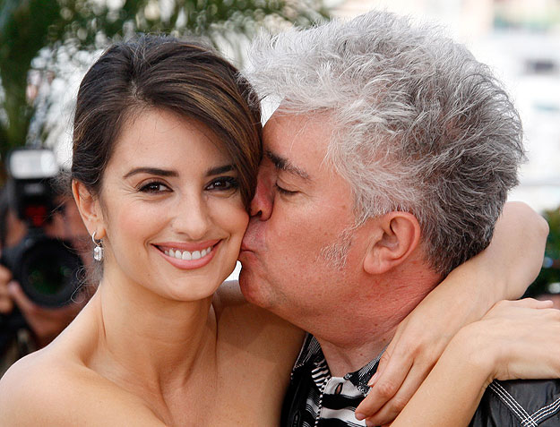 Director Pedro Almodovar (R) poses with cast member Penelope Cruz during a photocall for the film 