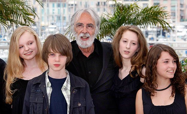 Director Michael Haneke (C) poses with cast members (L to R) Marie-Victoria Dragus, Leonard Proxauf, Roxanne Duran and Janina Fautz during a photo call for the film 