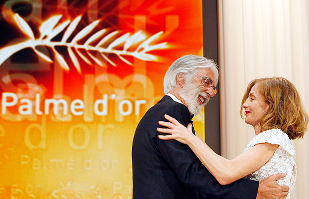 Director Michael Haneke walks on stage to get his the Palme d'Or award for the film 