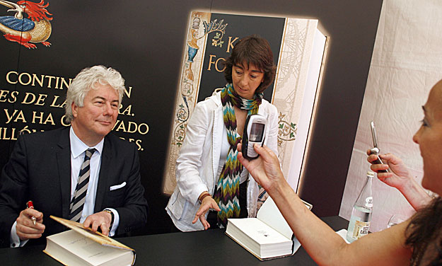 British author Ken Follett poses for his fans during a book signing of his book 