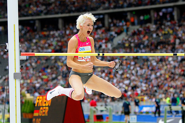 Ariane Friedrich of Germany reacts as she competes in the women's high jump event at the ISTAF golden league athletics competition in Berlin, June 14, 2009.     REUTERS/Tobias Schwarz     (GERMANY SPORT ATHLETICS)