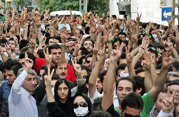 Protesters flash victory signs during a demonstration in Tehran June 28, 2009. Defeated Iranian presidential candidate Mirhossein Mousavi on Saturday rejected authorities' proposals for a partial recount of votes from this month's election and repeat