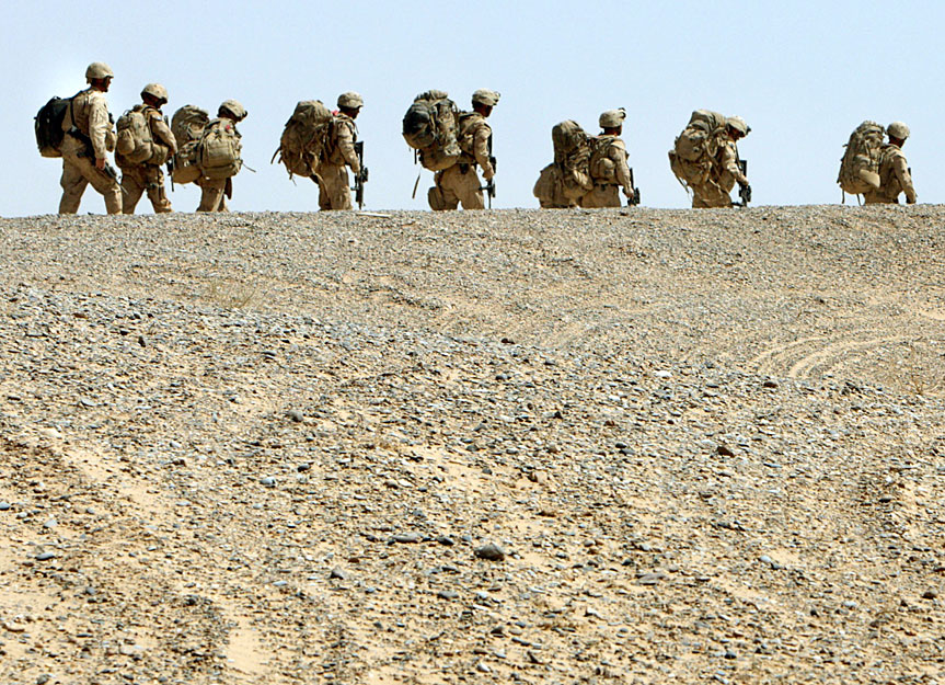 U.S. Marines walk to enter a helicopter in front of a base in Helmand province, southern Afghanistan, September 3, 2009.
REUTERS/Goran Tomasevic (AFGHANISTAN CONFLICT POLITICS)