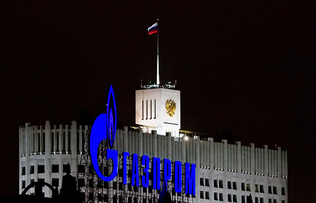 A Gazprom sign is seen in front of the White House, the seat of Russia's Prime Minister Vladimir Putin in Moscow January 14, 2009. European Union nations and firms may sue Russia and Ukraine unless the two countries quickly restore gas supplies to th