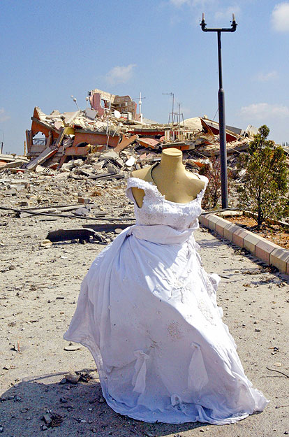 A mannequin adorned with a wedding dress stands near the site of an Israeli air raid in Qana July 31, 2006, where more than 54 women and children were killed a day earlier. International pressure for a swift ceasefire in Lebanon mounted on Monday, Fr