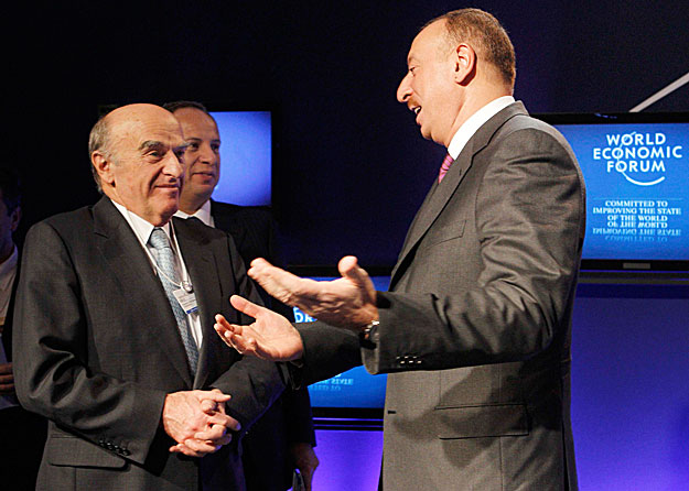 Azerbaijan's President Ilham Aliyev (R) speaks to Swiss Finance Minister Hans-Rudolf Merz after Global Energy Outlook session at the World Economic Forum (WEF) in Davos January 28, 2010.  REUTERS/Arnd Wiegmann (SWITZERLAND)