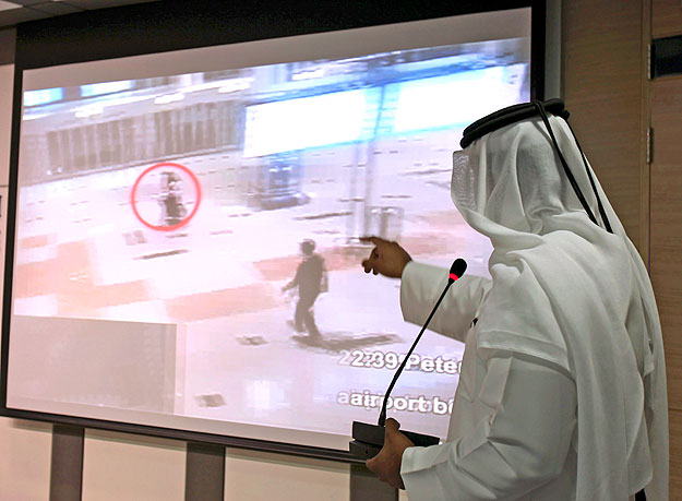 A presenter points to video footage showing suspects involved in the recent killing of Mahmoud al-Mabhouh, a senior Hamas military commander, during a news conference in Dubai February 15, 2010. Dubai will issue arrest warrants soon for 11 Europeans 