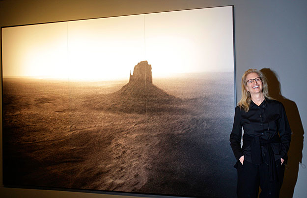 Photographer Annie Leibovitz from the U.S. poses in front of her picture 'Monument Valley' at the C/O gallery in Berlin, February 20, 2009. The gallery hosts her exhibition 'A Photographer's Life 1990-2005' from February 21 until May 24 in the German