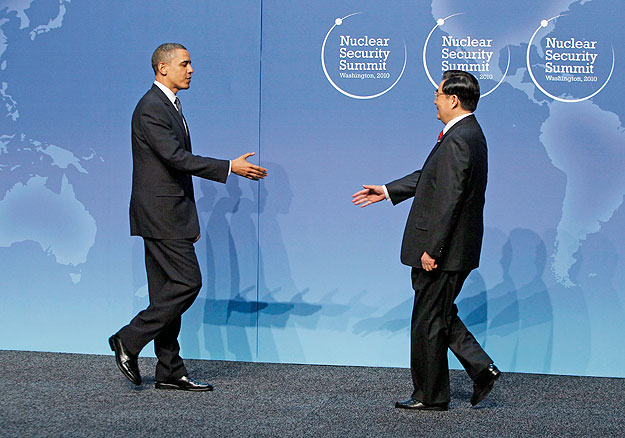 U.S. President Barack Obama (L) greets China's President Hu Jintao at the Nuclear Security Summit in Washington April 12, 2010. Obama opened a 47-nation summit dedicated to keeping nuclear arms from terrorists and seeks momentum with China in his pus