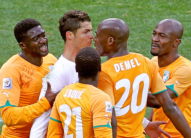 Ivory Coast's Guy Demel (20) argues with Portugal's Cristiano Ronaldo during a 2010 World Cup Group G soccer match at Nelson Mandela Bay stadium in Port Elizabeth June 15, 2010.          