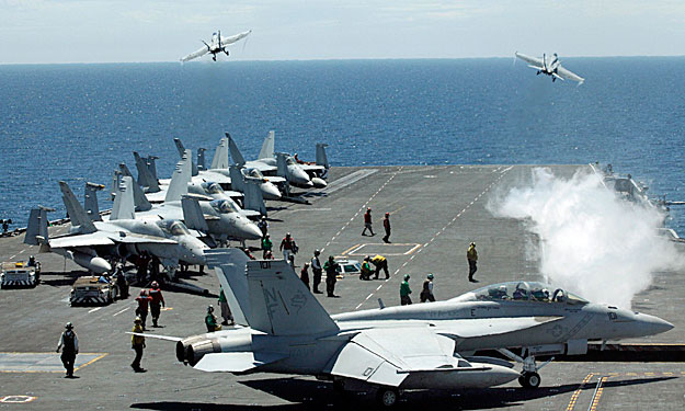 U.S. Navy F/A-18F Super Hornets take off from the flight deck of the Nimitz-class USS George Washington for joint military exercises between the U.S. and South Korea in South Korea's East Sea July 26, 2010. North Korea has declared a 