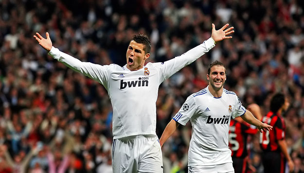 Real Madrid's Cristiano Ronaldo celebrates his team's second goal against AC Milan during their Champions League Group G soccer match at Santiago Bernabeu stadium in Madrid October 19, 2010.