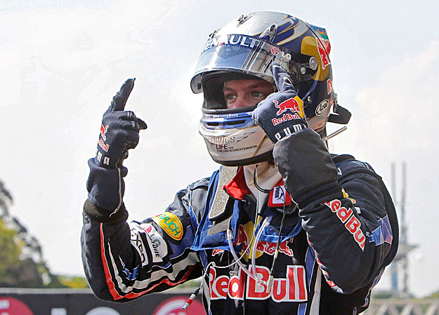 Red Bull Formula One driver Sebastian Vettel of Germany celebrates winning the Brazilian F1 Grand Prix at the Interlagos racetrack in Sao Paulo November 7, 2010.           REUTERS/Bruno Domingos (BRAZIL - Tags: SPORT MOTOR RACING)