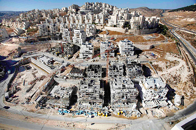 Houses under construction are seen in a Jewish settlement near Jerusalem known to Israelis as Har Homa and to Palestinians as Jabal Abu Ghneim December 8, 2010. The United States on Tuesday abandoned its effort to persuade Israel to freeze constructi