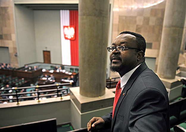 John Abraham Godson, Poland's first-ever black member of parliament, sits in the gallery of the country's lower house of parliament, on December 14 in Warsaw, the day he was sworn in to the office. Nigerian-born Godson, 40, is a Protestant pastor and