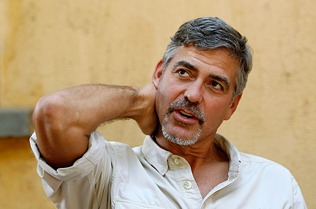 Actor George Clooney gestures during an interview with Reuters in Southern Sudan's capital Juba, January 8, 2011. REUTERS/Thomas Mukoya (SUDAN - Tags: PROFILE ENTERTAINMENT)